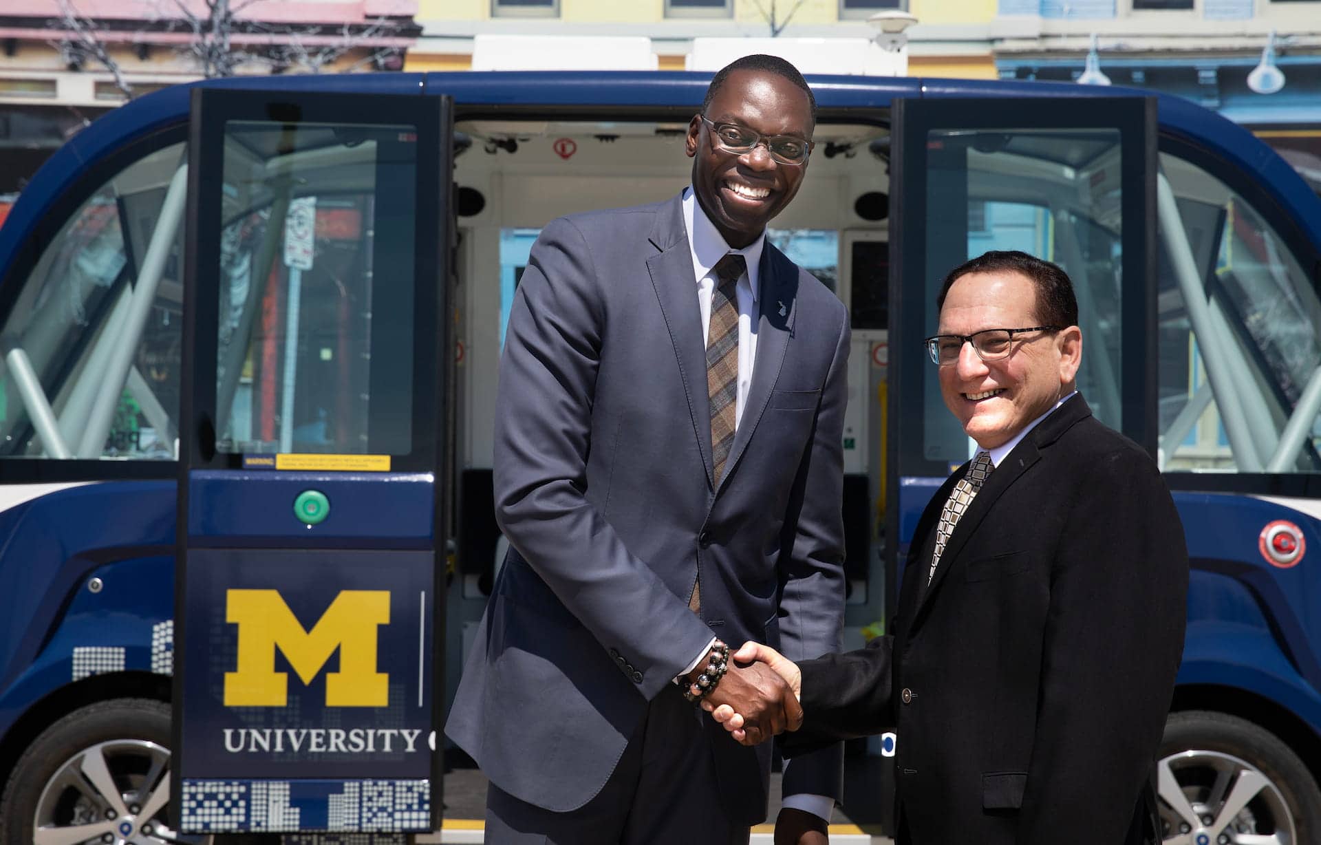 Lt. Governor Garlin Gilchrist II (right) shakes hands with Alan Taub, Director, University of Michigan EV Center and professor of materials science and engineering and mechanical engineering.